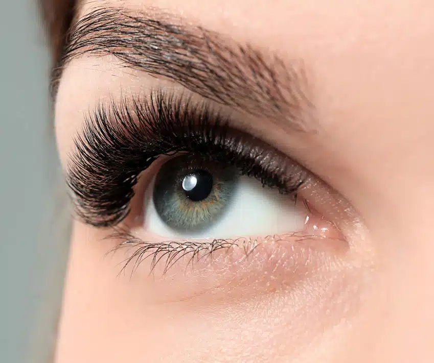 Woman with green eyes with Volume Lashes