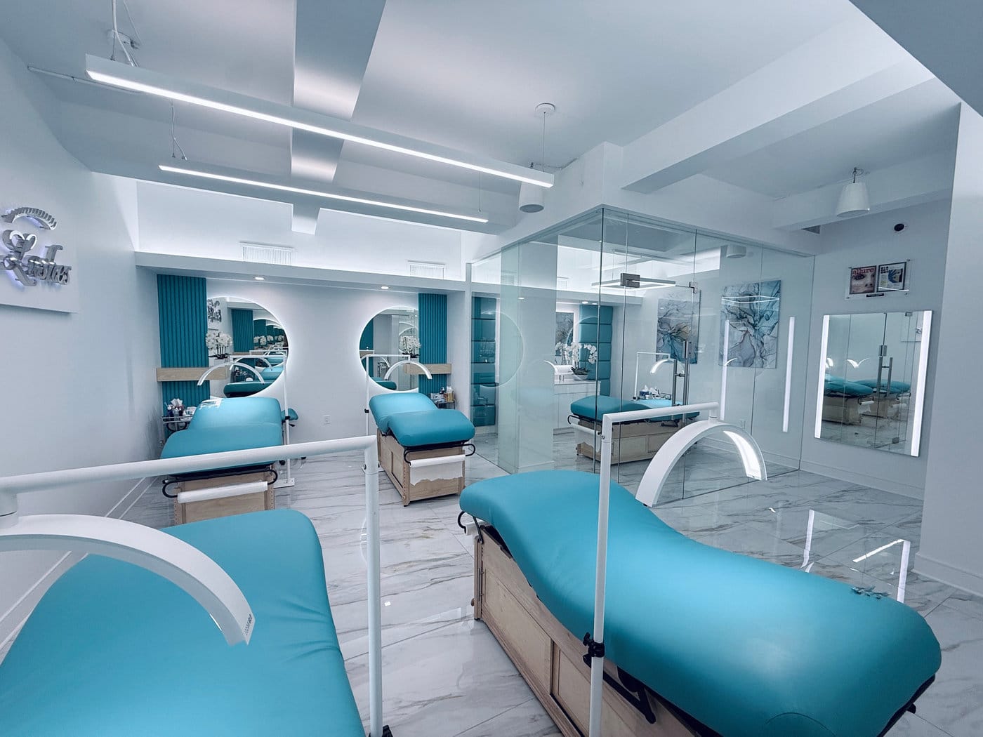 Treatment beds and lighting inside Envious Lashes, Midtown East Manhattan