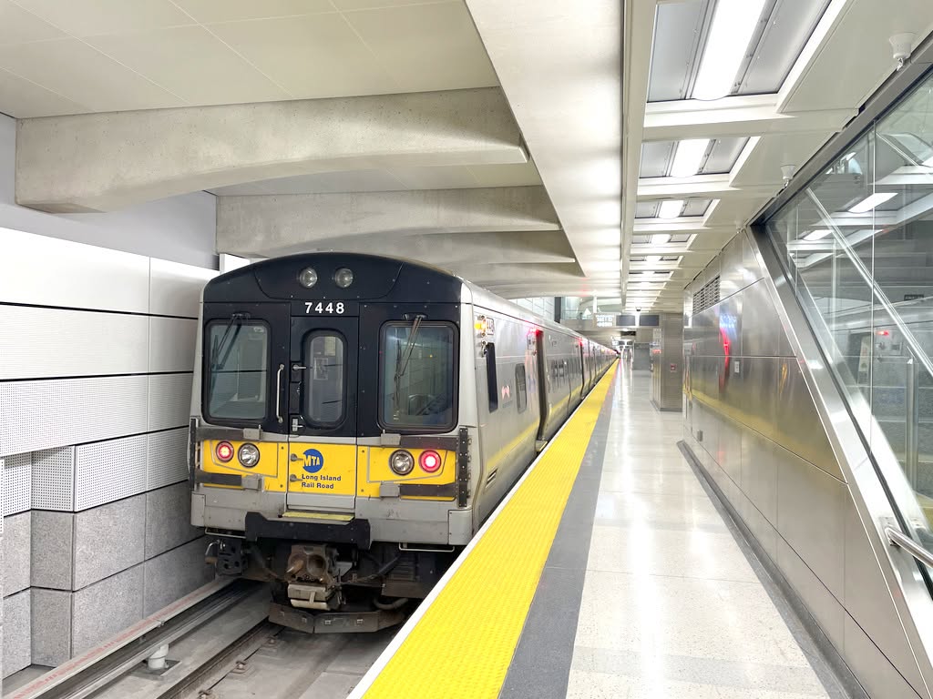 An LIRR train at Grand Central Madison, one block from Envious Lashes